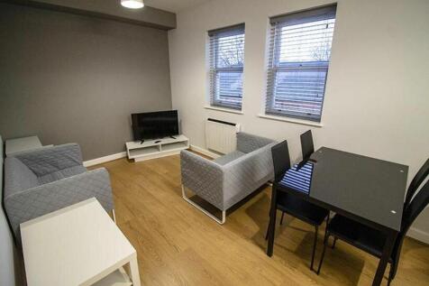 Spacious and inviting living room featuring mod...