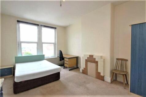 Bright and spacious double bedroom featuring la...