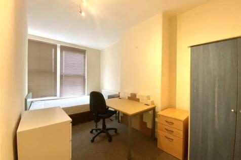 Spacious double bedroom featuring a comfortable...