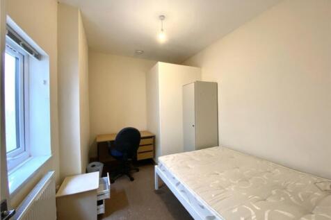 A bright and spacious double bedroom featuring ...
