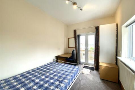 Bright and spacious double bedroom featuring a ...