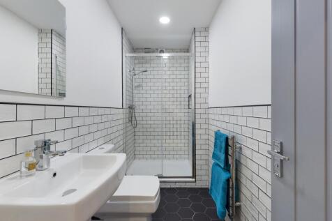 A modern and clean bathroom featuring stylish t...