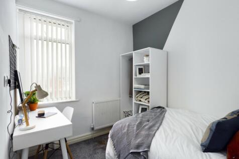 A bright and tidy double bedroom, featuring a s...