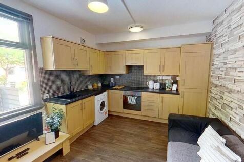 This modern kitchen features stylish cabinetry,...