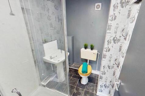A modern bathroom featuring sleek fixtures, a s...