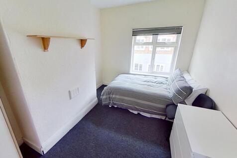 Bright and cozy double bedroom featuring a comf...