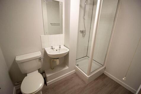 Bright and modern bathroom featuring a sleek sh...