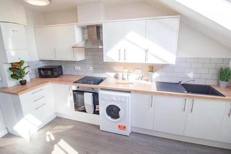 Bright and modern kitchen featuring ample count...
