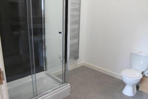 Bright and modern bathroom featuring a spacious...