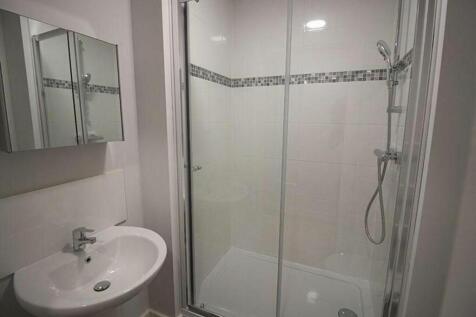 Modern bathroom suite featuring a spacious show...