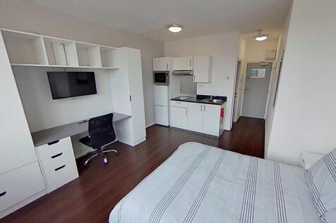This inviting double bedroom features a comfort...