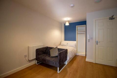 Spacious double bedroom featuring a comfortable...