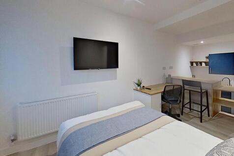 A stylish double bedroom featuring a comfortabl...