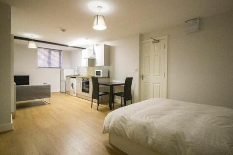 A bright and modern double bedroom featuring a ...