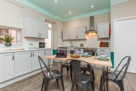 A bright and modern kitchenette equipped for so...