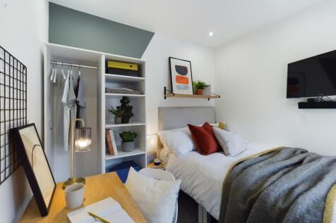 A stylish and inviting double bedroom featuring...