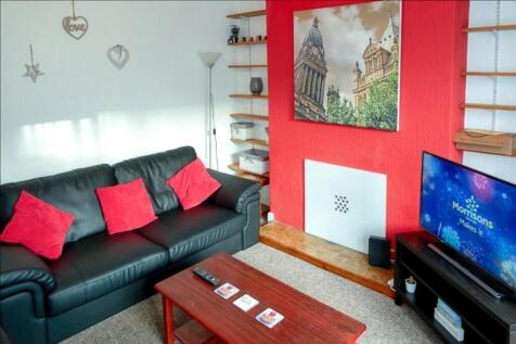 A cozy and inviting living room featuring a com...