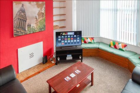 A bright and inviting living room featuring com...