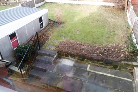 A charming garden space featuring well-maintain...