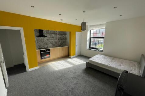 Spacious double bedroom featuring a vibrant acc...