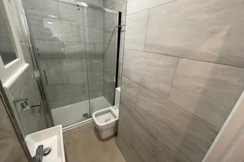 A modern bathroom suite featuring a sleek showe...