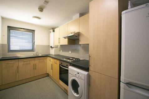 This modern kitchen features ample storage with...