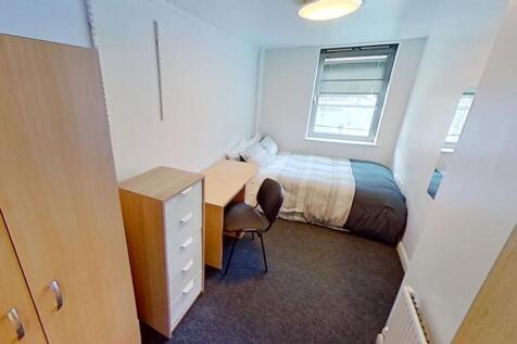 Cozy double bedroom with ample natural light, f...