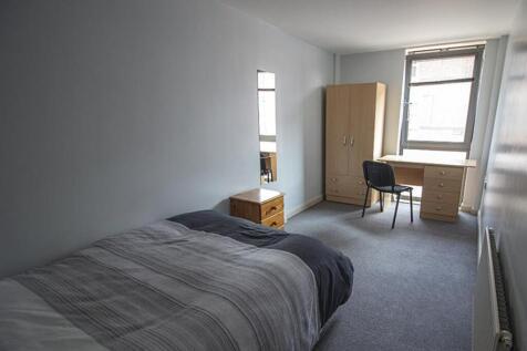 Spacious double bedroom featuring ample natural...