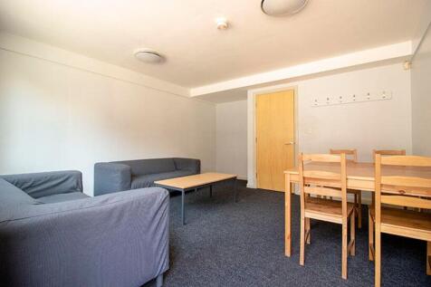A spacious living room featuring comfortable se...