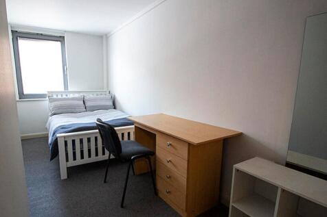 A bright and inviting double bedroom featuring ...