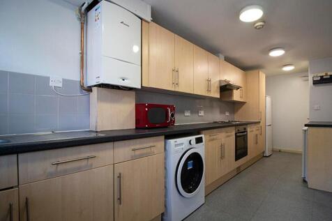 Spacious kitchen featuring modern appliances an...