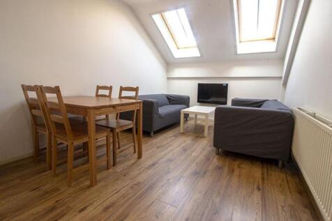 Bright and inviting living room with ample natu...