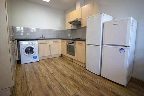Modern kitchen with ample storage space, equipp...
