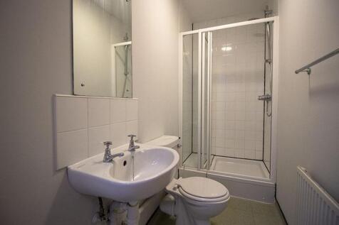 A modern bathroom featuring a clean design with...
