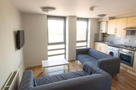 A bright and spacious living room featuring lar...
