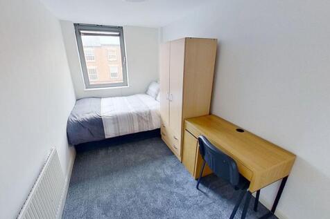 A cozy double bedroom featuring a comfortable b...