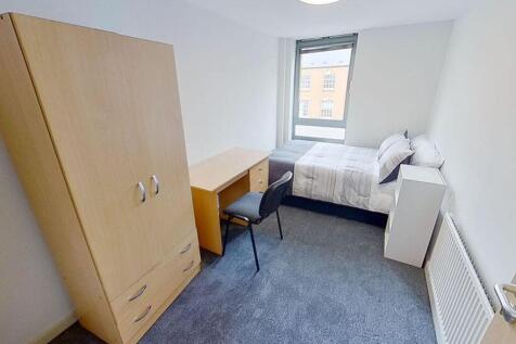 Spacious and well-lit double bedroom featuring ...