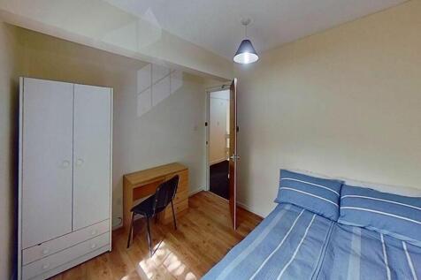 A cozy double bedroom featuring natural light, ...