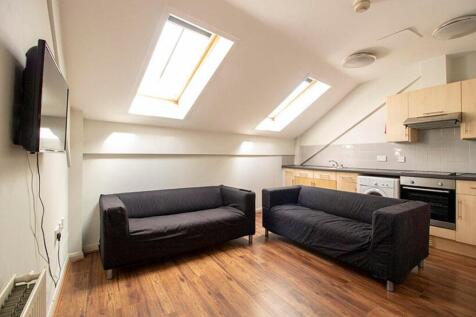 A bright and inviting living room featuring two...