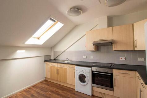 This modern kitchen features ample storage with...