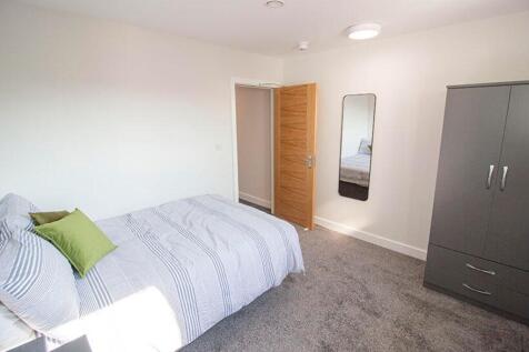 Bright and inviting double bedroom featuring am...