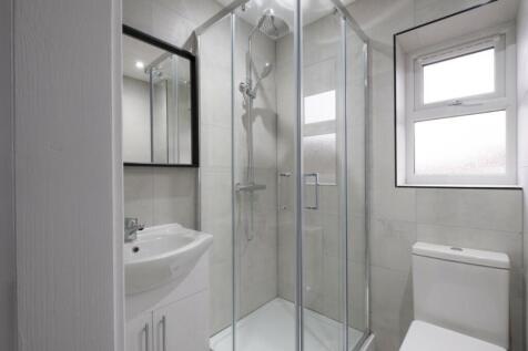 A modern and stylish bathroom featuring a spaci...