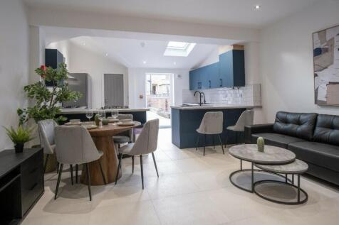 A stylish and modern living area featuring a co...