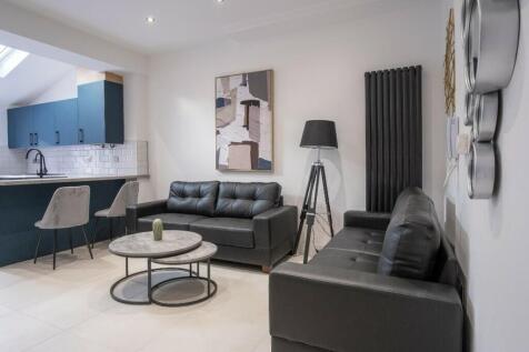 A stylish living room featuring modern furnishi...