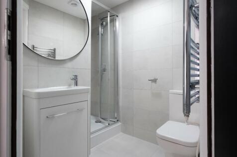 Modern bathroom featuring sleek design with a s...