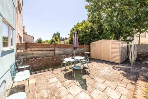 A beautifully maintained garden space featuring...