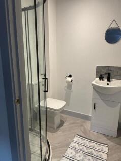 A modern bathroom featuring a sleek design with...