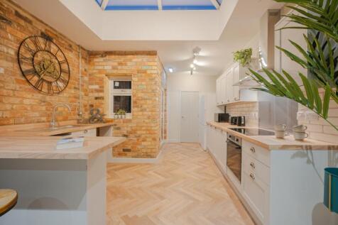 A beautifully designed kitchen featuring modern...