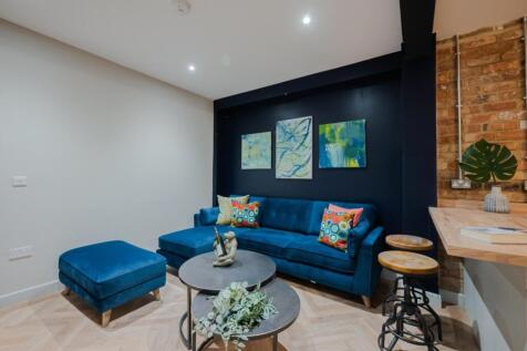 A stylish and inviting living room featuring a ...