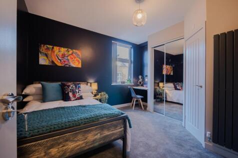 A beautifully designed double bedroom featuring...